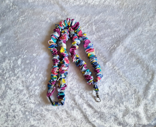 Floral fabric scrunchie lanyard with safety breakaway buckle holding keys